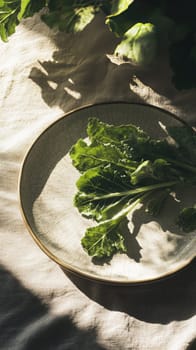 Fresh leafy greens rest on a crackled glaze ceramic plate, illuminated by sunlight filtering through a window. Shadows dance gently, enhancing the tranquil ambiance of the scene.
