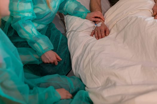 Healthcare professionals are diligently tending to a patient in a critical hospital environment, ensuring proper care
