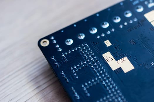 This image features a detailed closeup shot of a computer motherboard, prominently displaying the letter L on its surface, showcasing its intricate design