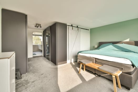 A well-designed modern bedroom featuring sleek furniture, light colors, and an inviting atmosphere, ideal for relaxation and comfort.