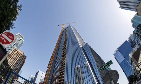 From below fisheye lens view of The Republic building in downtown Austin Texas in spring
