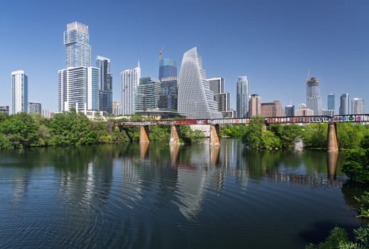 Austin, TX - 10 April 2025: Panoramic skyline of Austin Texas along Colorado River from west