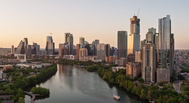 Austin, TX - 10 April 2025: Aerial panoramic skyline of Austin Texas from the east at dusk or sunset