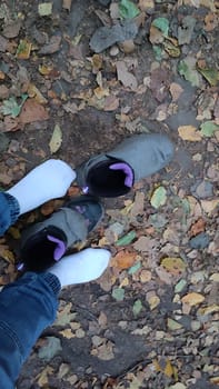 Socks fallen boots shoes people women travel tourism summer day outdoor shotlisttravel nature leaves landscape background summer day . High quality photo sport walking street men