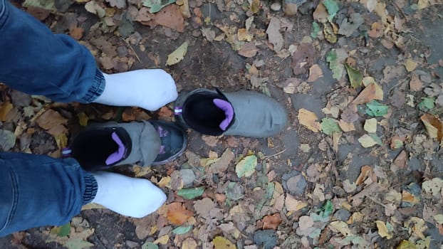 Socks fallen boots shoes people women travel tourism summer day outdoor shotlisttravel nature leaves landscape background summer day . High quality photo sport walking street men