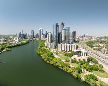 Austin, TX - 10 April 2025: Aerial panoramic skyline of Austin Texas from the east with I35 in foreground