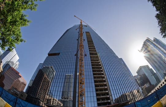 From below fisheye lens view of The Republic building in downtown Austin Texas in spring