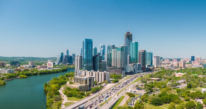 Austin, TX - 10 April 2025: Aerial panoramic skyline of Austin Texas from the east with I35 in foreground