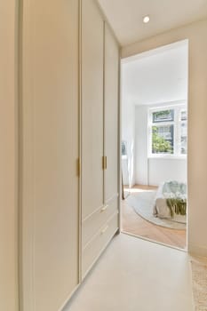 A sleek and modern interior design showcases a minimalist room featuring light colors, a spacious layout, and contemporary furniture for a calming atmosphere.