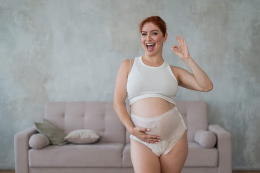 Happy Pregnant Woman Recommends Adult Diapers