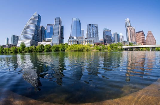 Water level view of skyline of Austin Texas using fisheye lens to capture unique view of the city