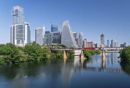 Austin, TX - 10 April 2025: Panoramic skyline of Austin Texas along Colorado River from west