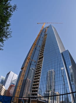 From below fisheye lens view of The Republic building in downtown Austin Texas in spring