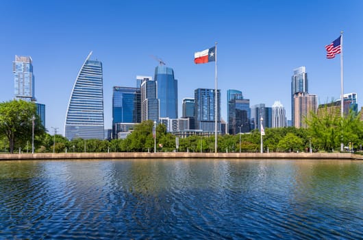 Austin, TX - 10 April 2025: Downtown City skyline with Google Block 185 distinctive building over Palmer Lake