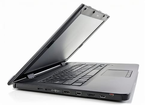 A modern, slim laptop stands open and ready for use against a stark white background, awaiting input.