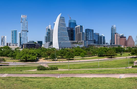 Broad panorama of the office and apartment buildings of Austin Texas skyline from Town park