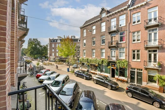 A picturesque street view showcasing historic buildings lined with trees and parked cars, capturing the essence of urban life and architecture.