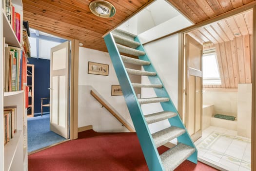 A cozy interior showcasing a unique stair design, wooden accents, and well-organized spaces. Ideal for interiors lovers and design enthusiasts.