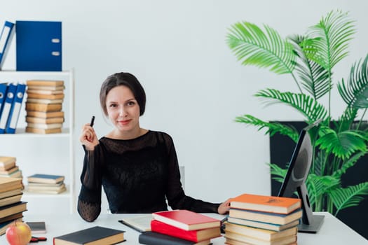 Woman in business suit working at desk in office training