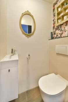 A stylish modern bathroom showcasing elegant fixtures, a chic mirror, and tasteful decor. The design emphasizes cleanliness and functionality.