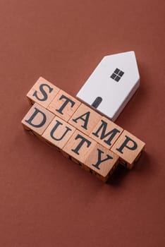 Stamp duty tax, property investment concept, business processes related to real estate. Stamp duty inscription as a background for business design