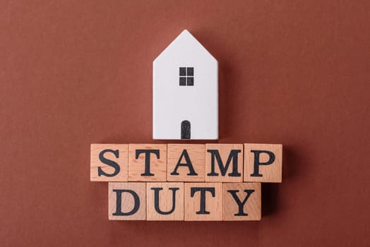 Stamp duty tax, property investment concept, business processes related to real estate. Stamp duty inscription as a background for business design