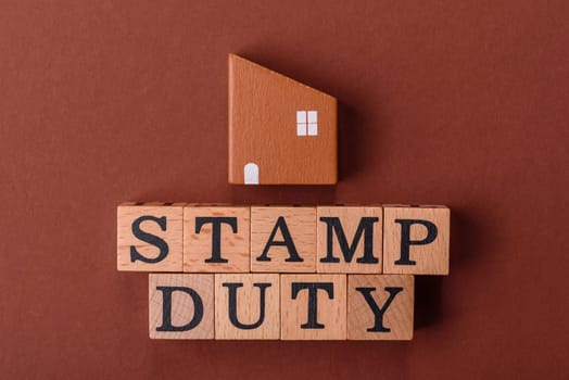 Stamp duty tax, property investment concept, business processes related to real estate. Stamp duty inscription as a background for business design