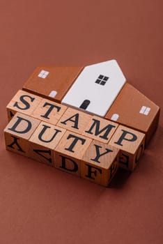 Stamp duty tax, property investment concept, business processes related to real estate. Stamp duty inscription as a background for business design