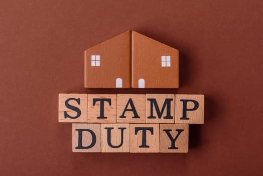 Stamp duty tax, property investment concept, business processes related to real estate. Stamp duty inscription as a background for business design