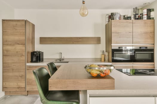 A contemporary kitchen featuring wooden cabinets, sleek appliances, and stylish decor, combining functionality with modern design elements.
