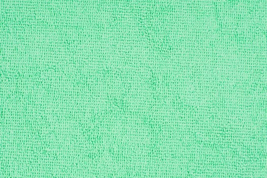 Textured surface microfiber cloth with complex loop pattern, ideal for wiping dust and dirt during delicate cleaning of the house, soft mint color
