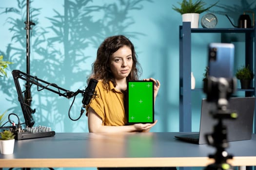 Content creator filming technology haul, doing unboxing video of mockup tablet. Tech guru unpacking isolated screen device product, recording review for internet channel, entertaining fans