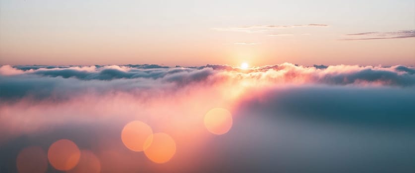 The breathtaking sight features delicate wispy cirrus clouds gracefully floating in a vibrant blue sky. A radiant half moon adds a celestial touch to the stunning sunset colors of orange and yellow.