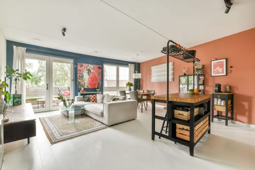 A stylish modern living room featuring vibrant wall colors, contemporary furniture, and an inviting layout perfect for relaxation and gatherings.