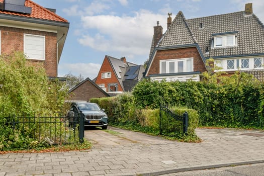 A picturesque view of a residential neighborhood featuring attractive houses, lush greenery, and well-maintained walkways enhancing the suburban charm.