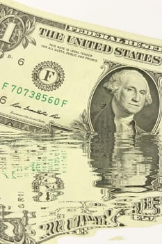 Creative conceptual image of US dollar bills partially submerged in water with a water reflection effect. Symbolizes financial crisis, liquidity problems, or a fluctuating economy. Ideal for articles or graphics related to money, finance, economics, or global markets.