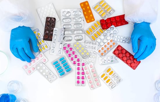 medicines in the hands of a doctor. Selective focus. pills.
