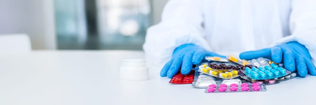 medicines in the hands of a doctor. Selective focus. pills.