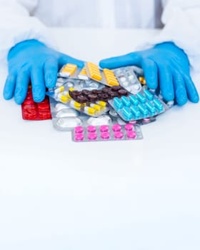 medicines in the hands of a doctor. Selective focus. pills.