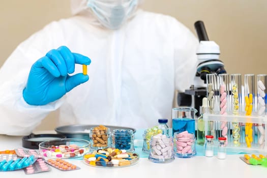 examine drugs in the laboratory. Selective focus. pills.