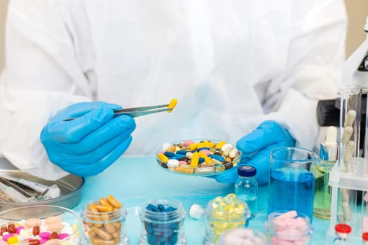 examine drugs in the laboratory. Selective focus. pills.