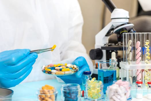 examine drugs in the laboratory. Selective focus. pills.