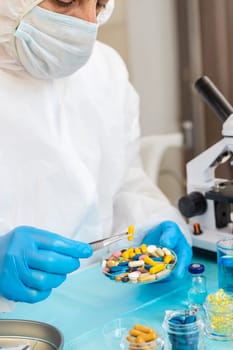 examine drugs in the laboratory. Selective focus. pills.