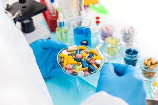 examine drugs in the laboratory. Selective focus. pills.