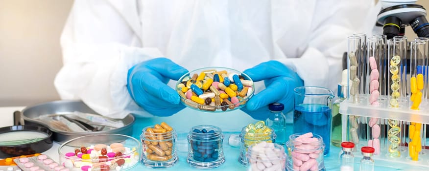 examine drugs in the laboratory. Selective focus. pills.