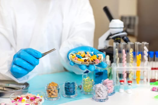 examine drugs in the laboratory. Selective focus. pills.