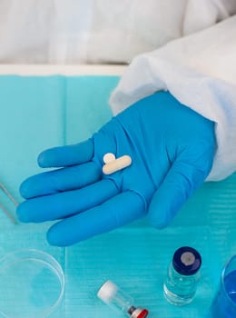 medicines in the hands of a doctor. Selective focus. pills.