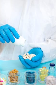 examine drugs in the laboratory. Selective focus. pills.