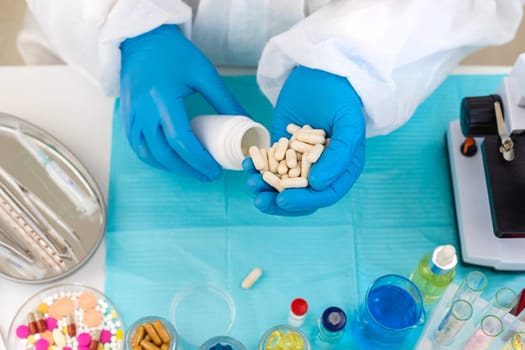 examine drugs in the laboratory. Selective focus. pills.