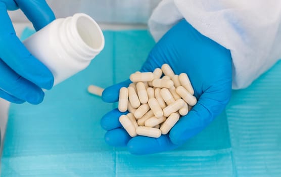 medicines in the hands of a doctor. Selective focus. pills.